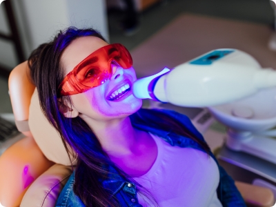 Dental patient receiving teeth whitening