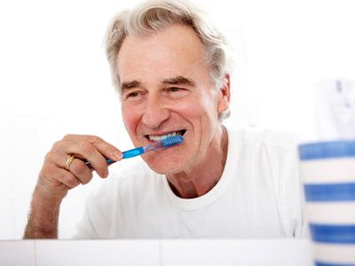 a person brushing their teeth at home