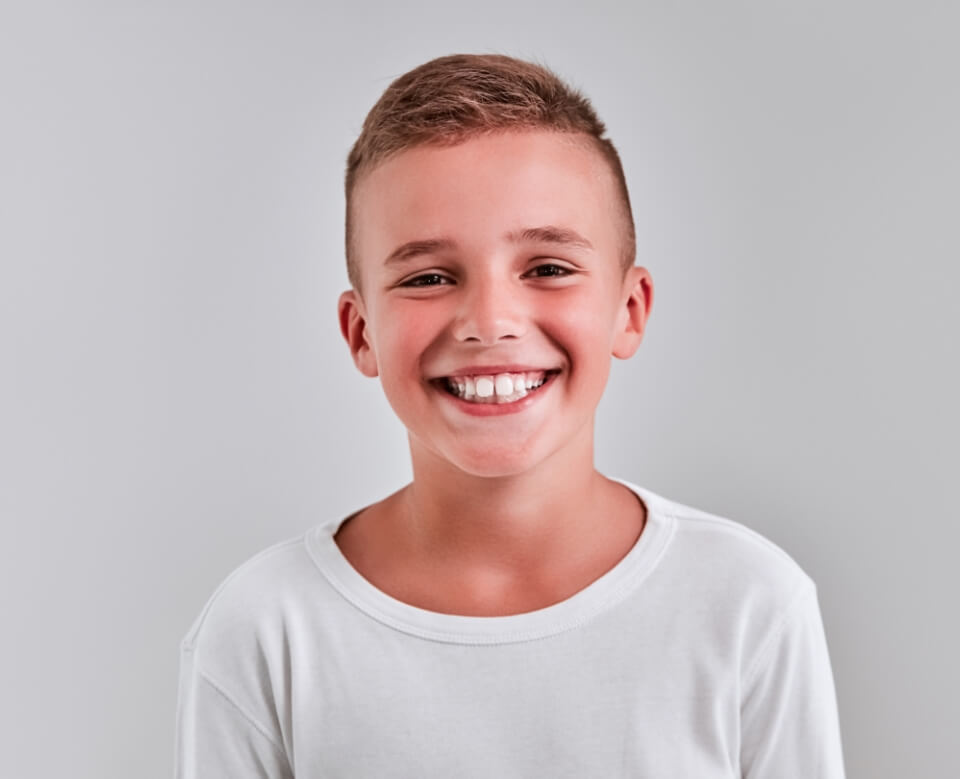 Child smiling after visiting their children's dentist