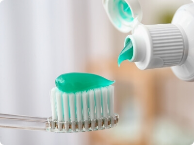 Fluoride treatment gel on toothbrush